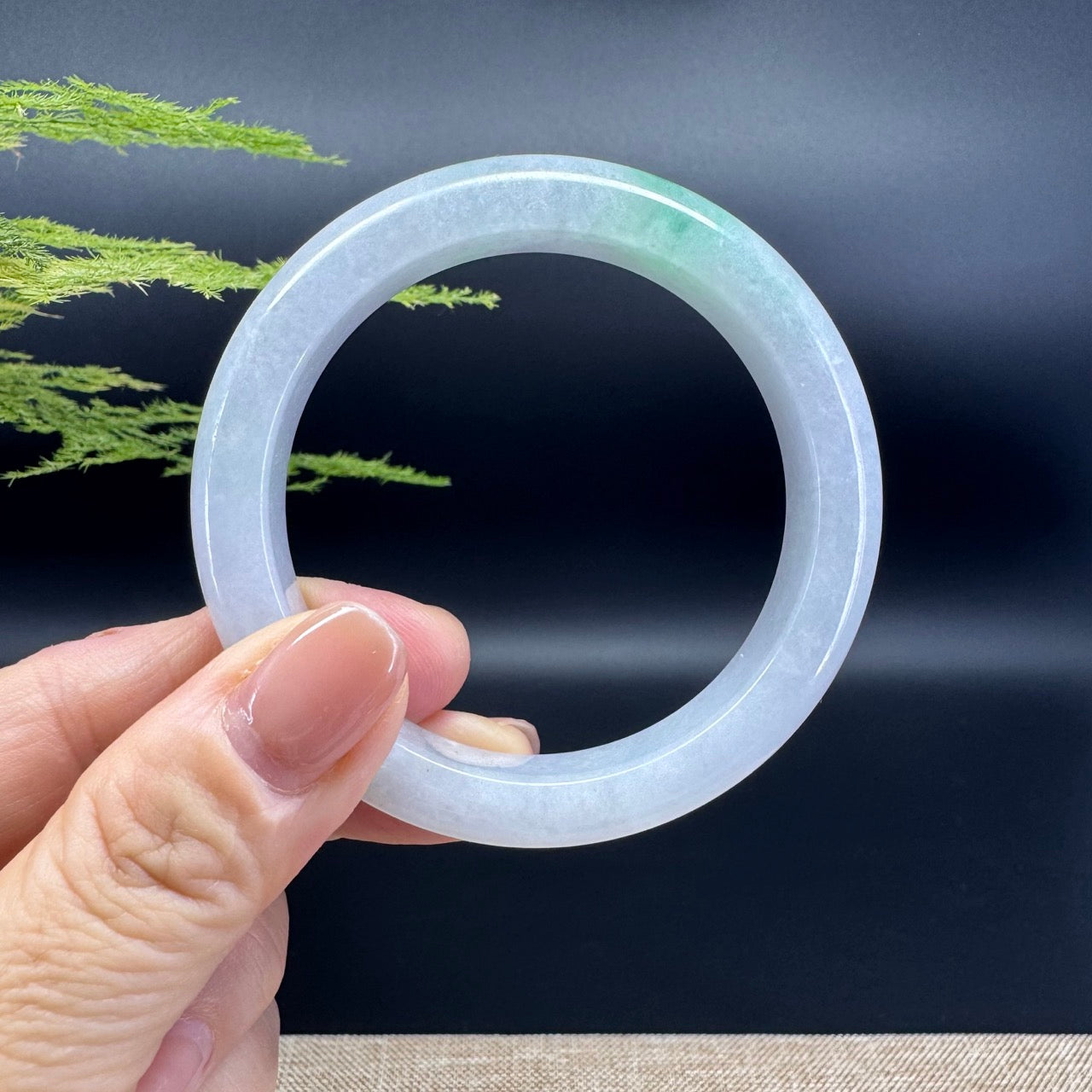 The bangle shape of the half round.The bangle color is lavender green.