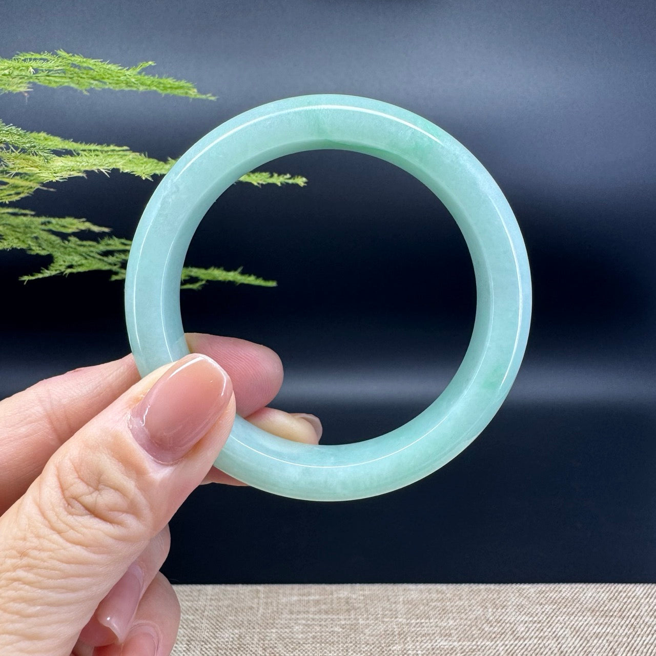 The bangle shape of the half round.The bangle color is apple green.