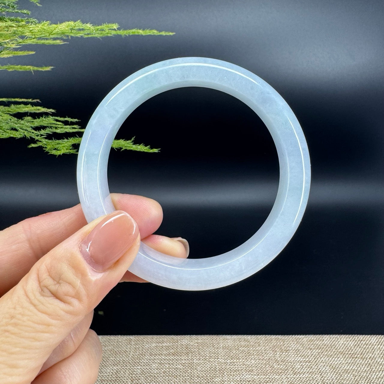The bangle shape of the half round.The bangle color is lavender green.