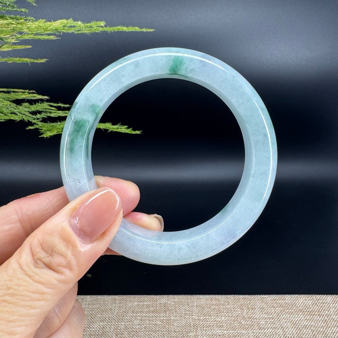 The bangle shape of the half round.The bangle color is blue green.