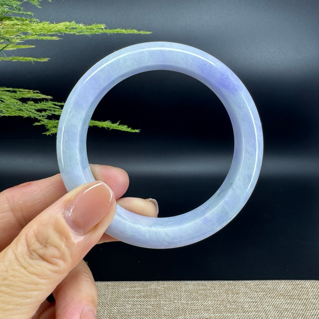 The bangle shape of the half round.The bangle color is lavender.