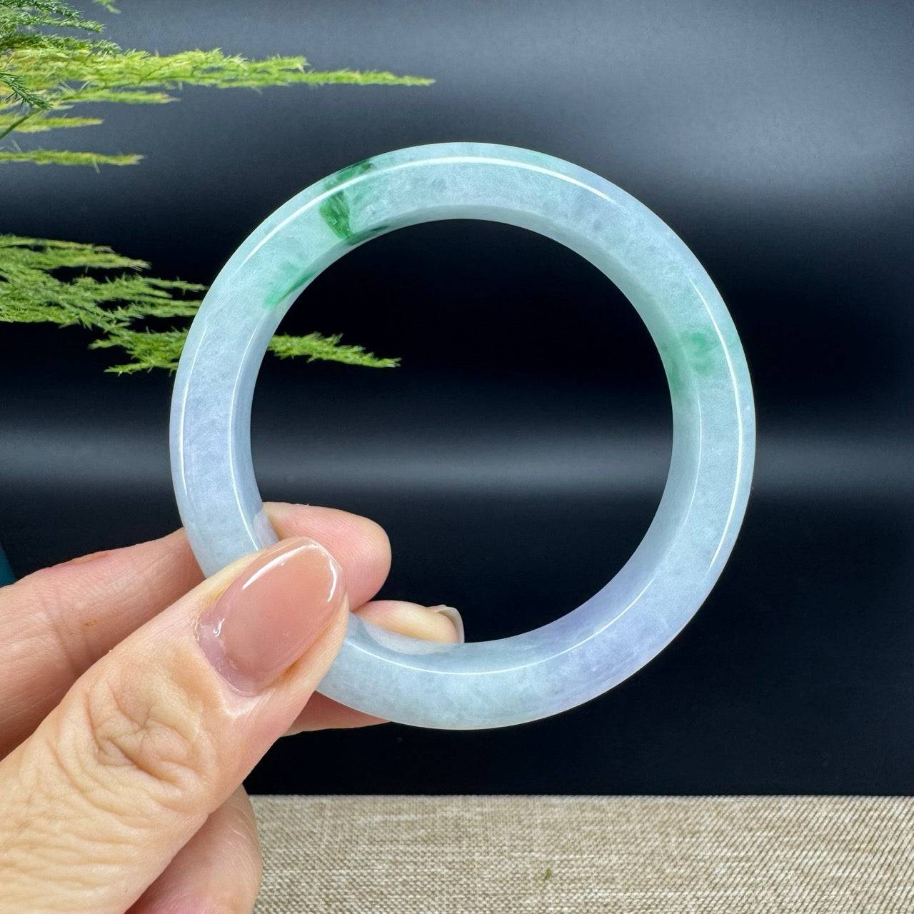 The bangle shape of the half round.The bangle color is lavender green.