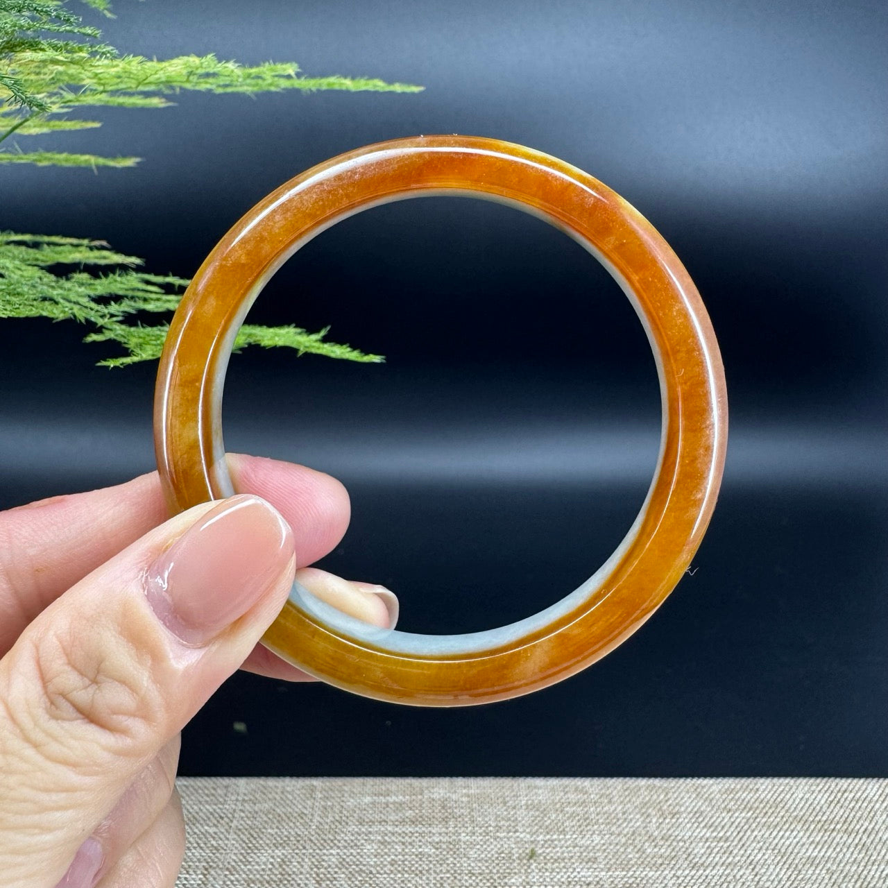 The bangle shape of the half round.The bangle color is icy honey yellow.