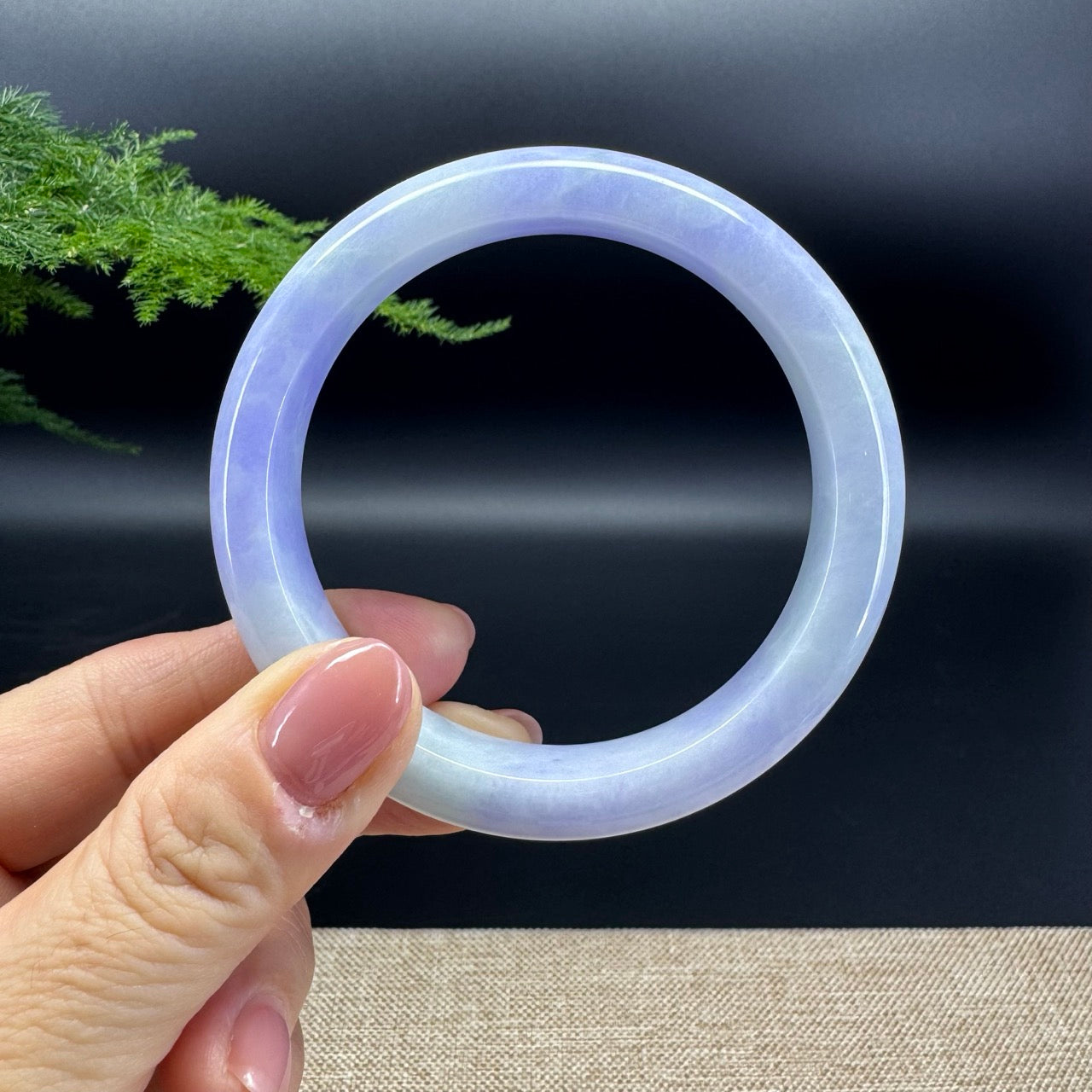 The bangle shape of the half round.The bangle color is lavender.