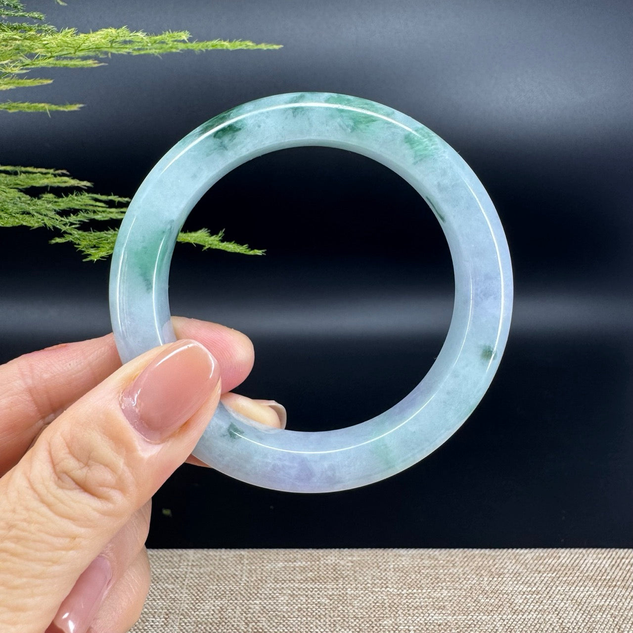 The bangle shape of the half round.The bangle color is icy green.