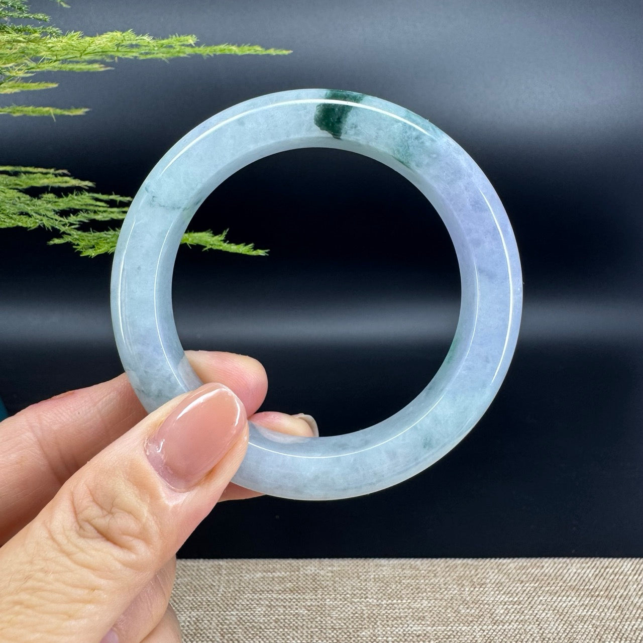 The bangle shape of the half round.The bangle color is icy green.