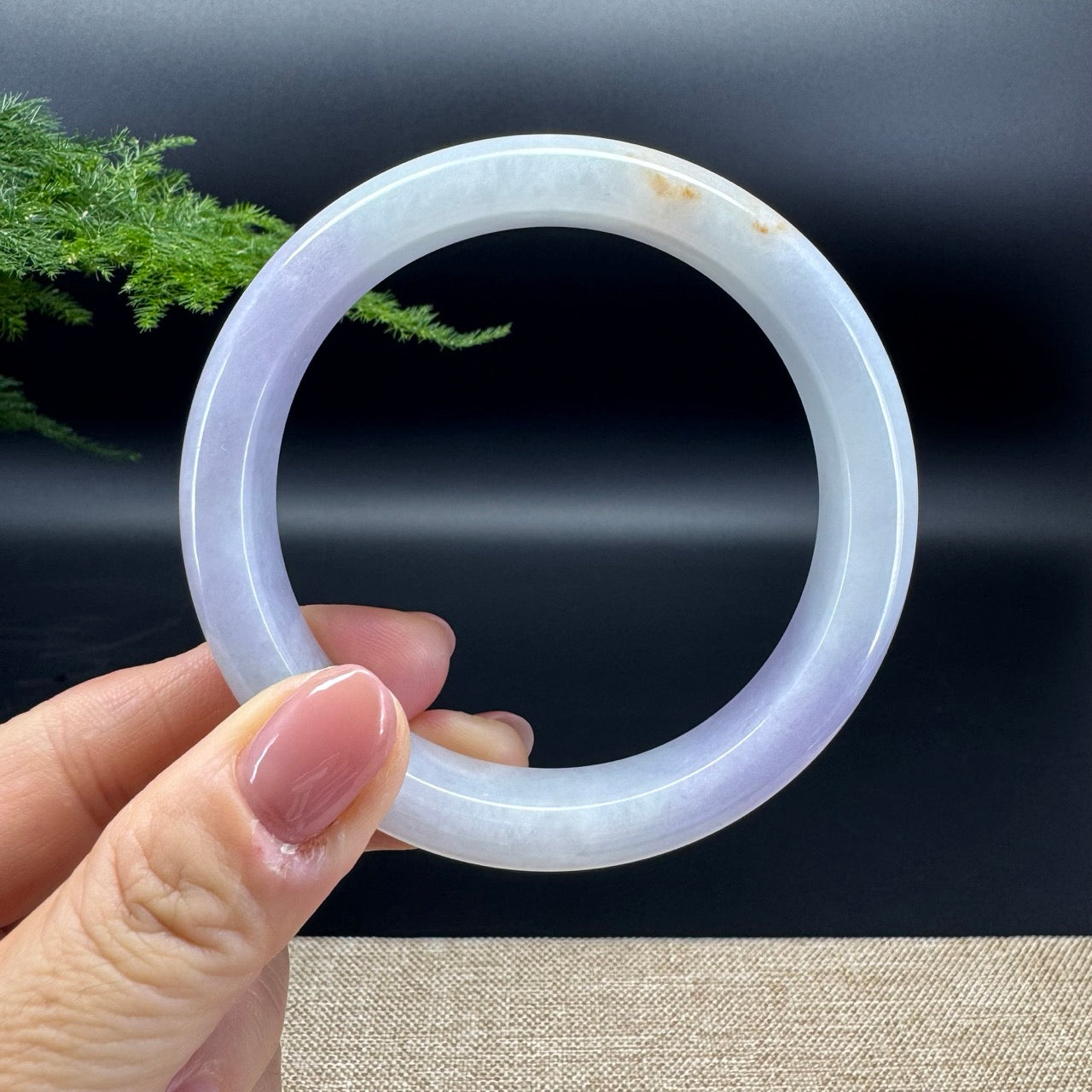 The bangle shape of the half round.The bangle color is lavender and some sajin.