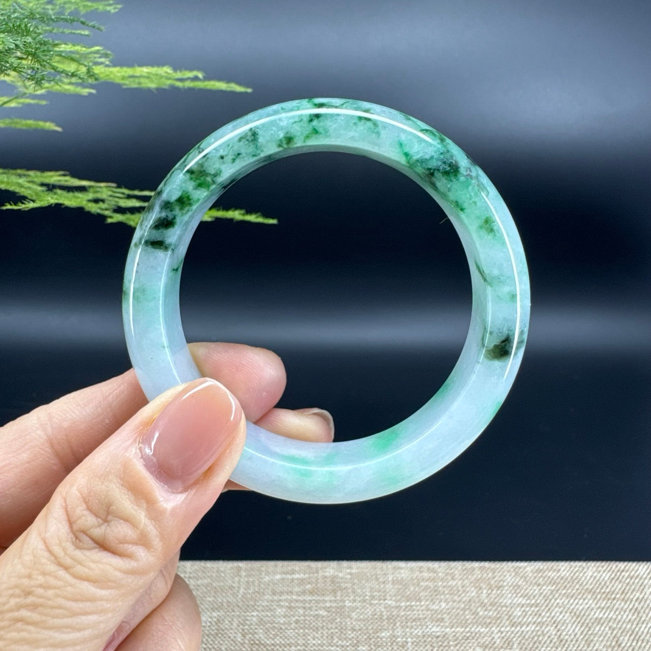 The bangle shape of the half round.The bangle color is icy oil green.