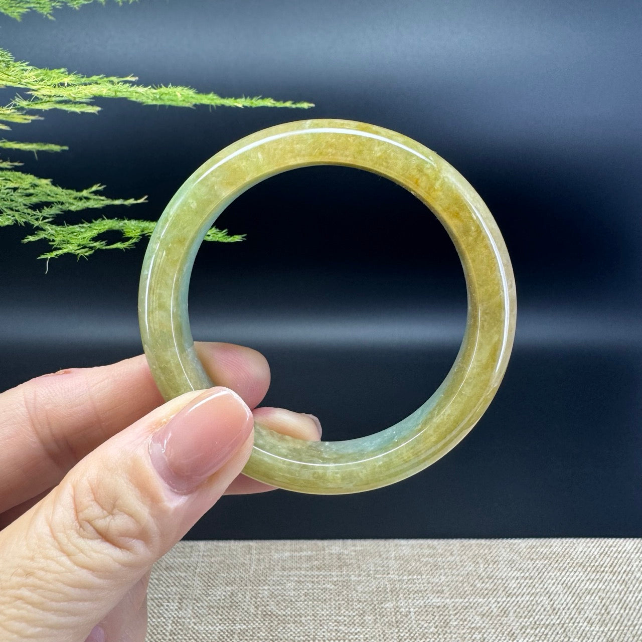 The bangle shape of the half round.The bangle color is yellow green.