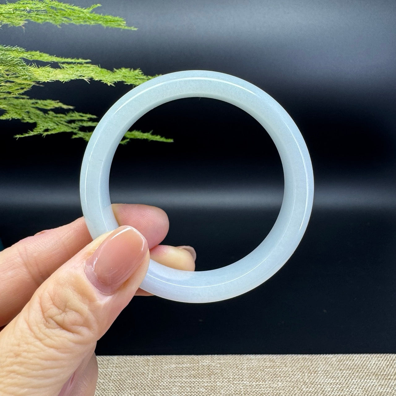 The bangle shape of the half round.The bangle color is icy green.