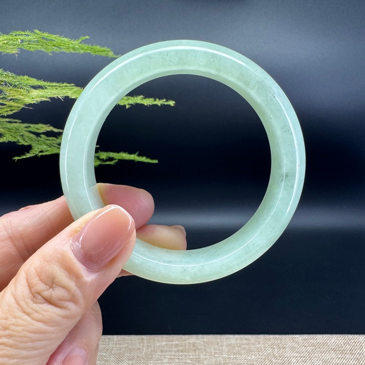 The bangle shape of the half round.The bangle color is icy green.