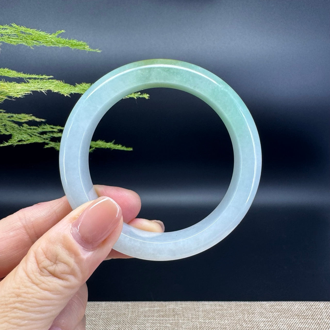 The bangle shape of the half round.The bangle color is lavender green.