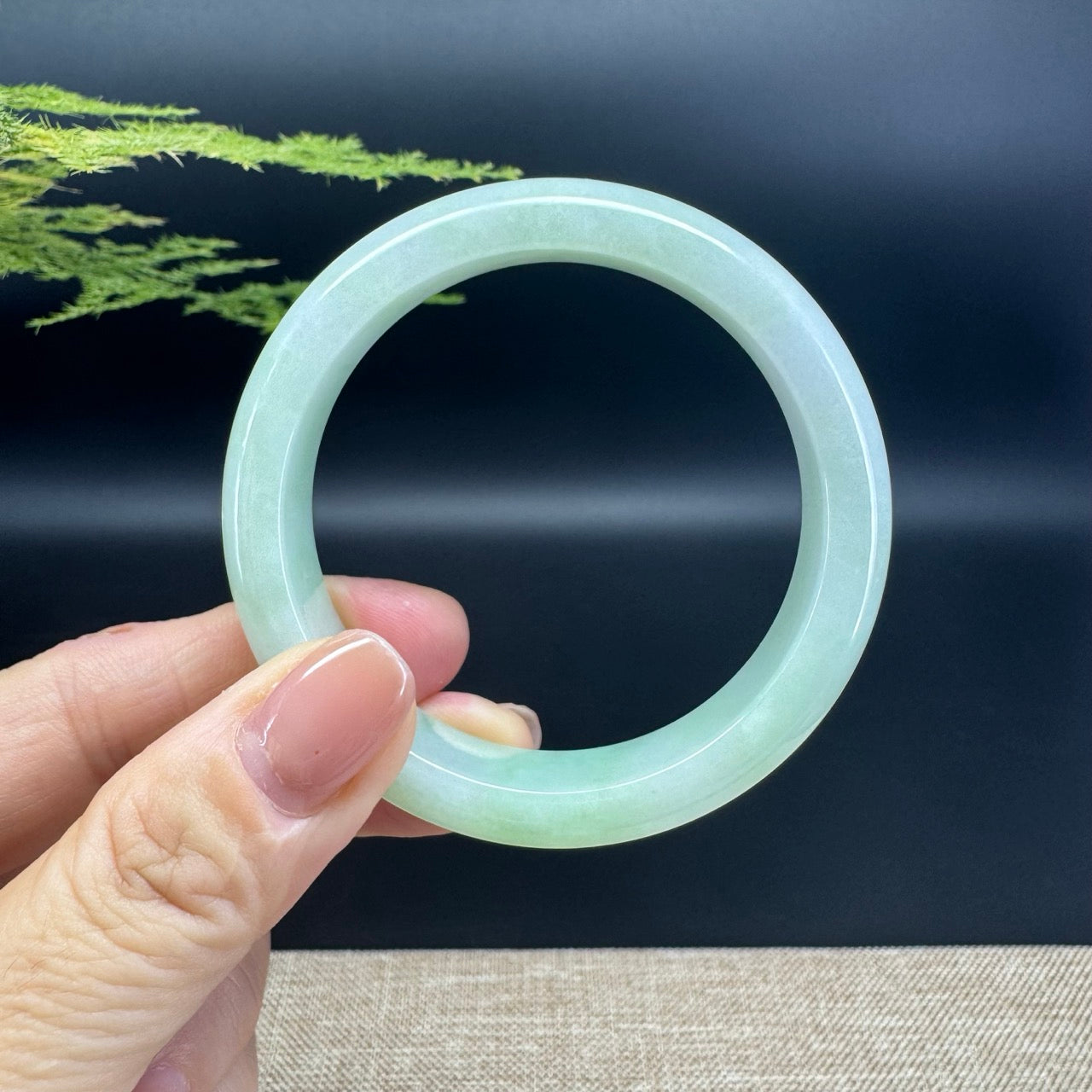 The bangle shape of the half round.The bangle color is apple green.