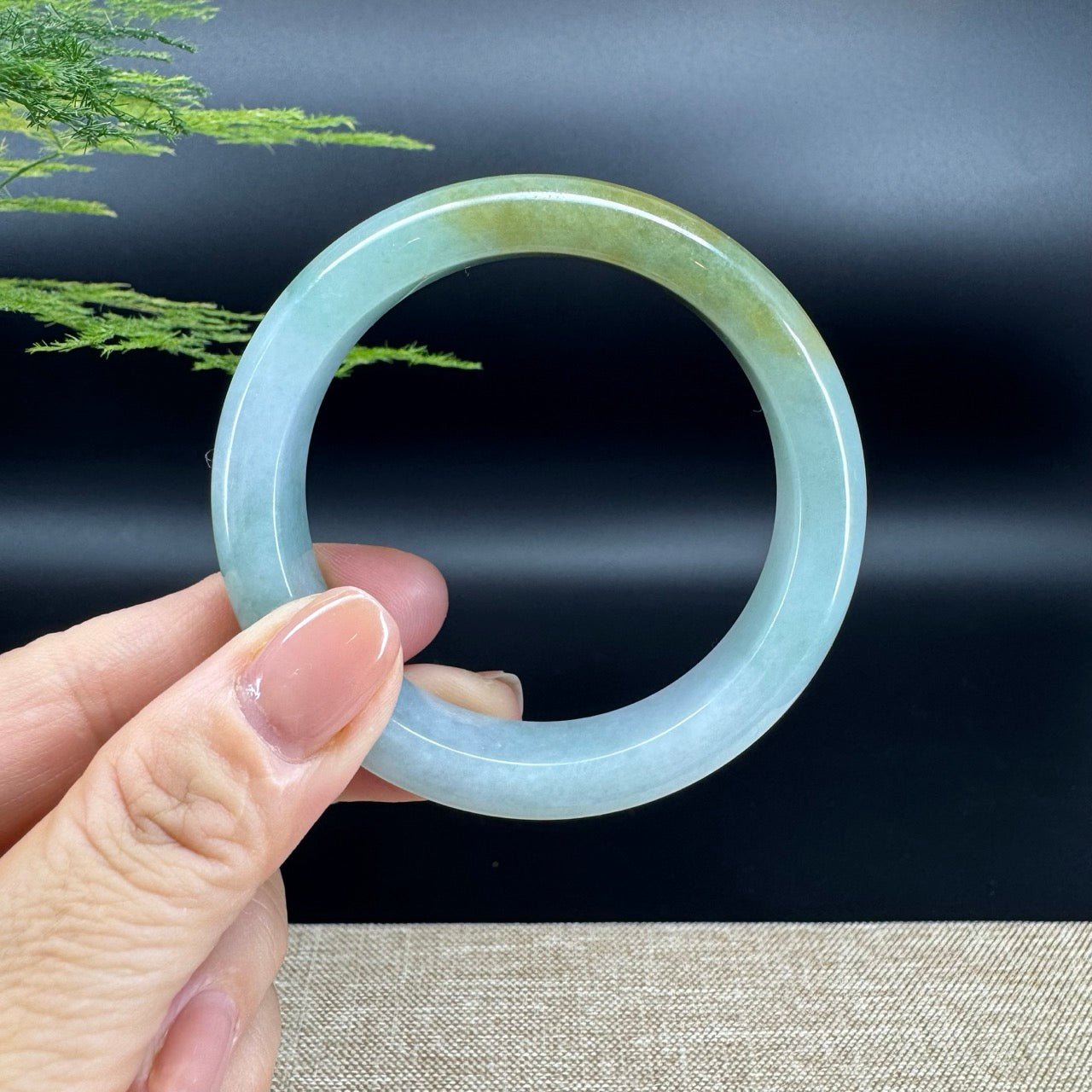 The bangle shape of the half round.The bangle color is lavender blue green.