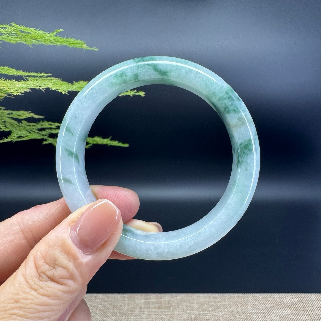 The bangle shape of the half round.The bangle color is icy blue flower.