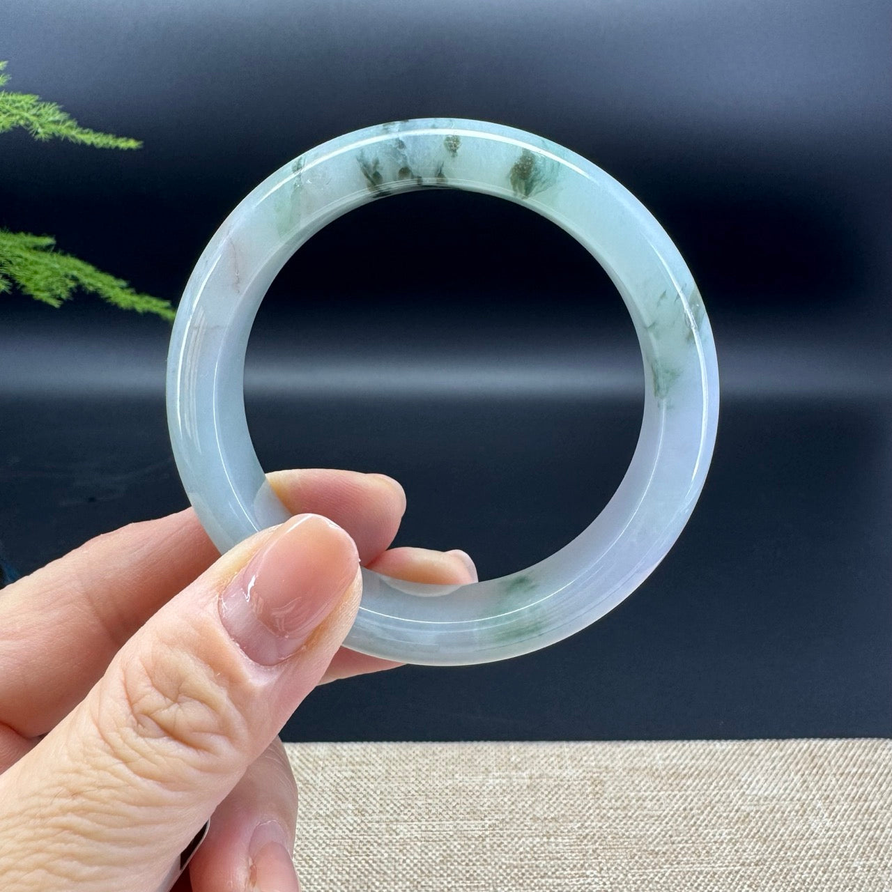 The bangle shape of the half round.The bangle color is icy lavender green flower.