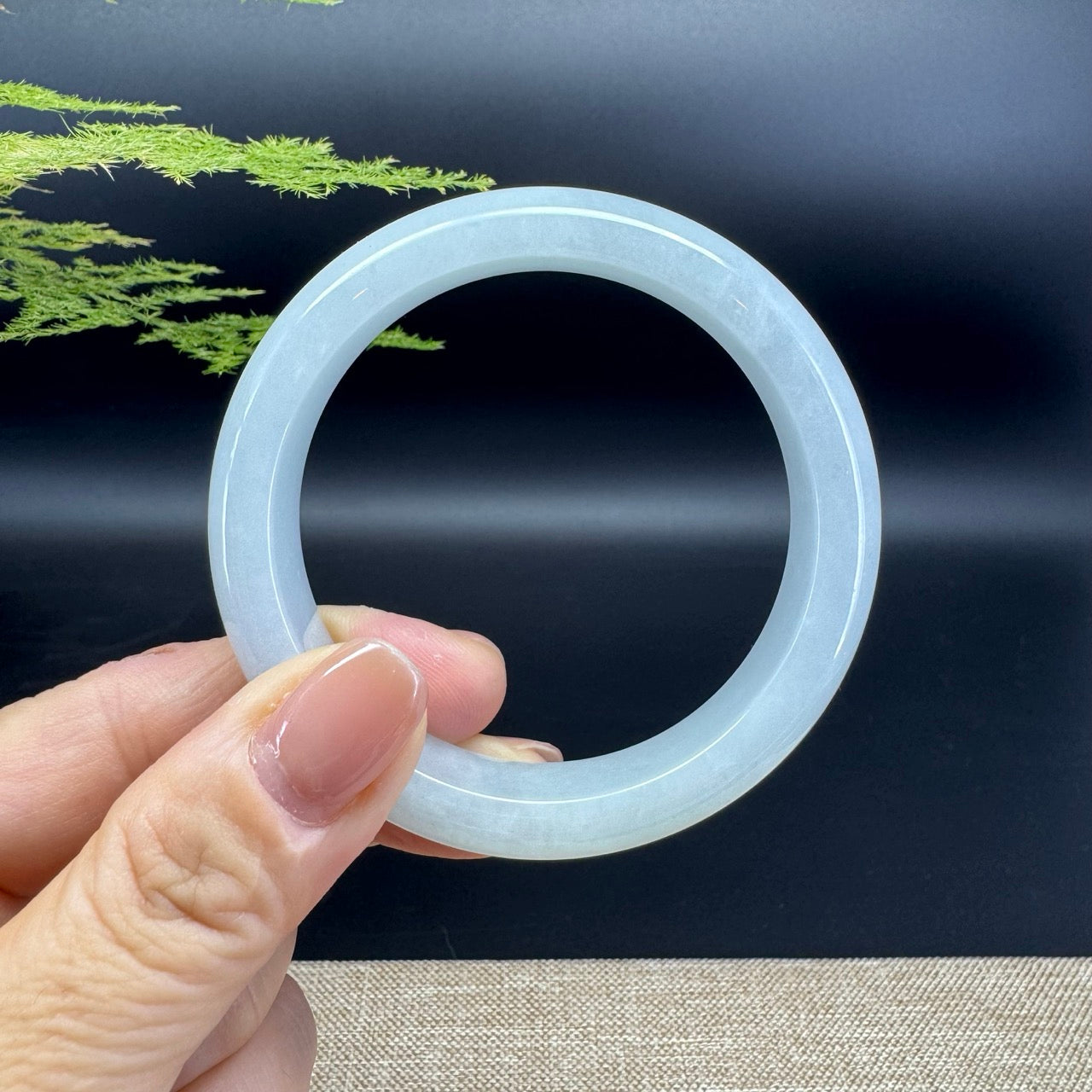 The bangle shape of the half round.The bangle color is green.