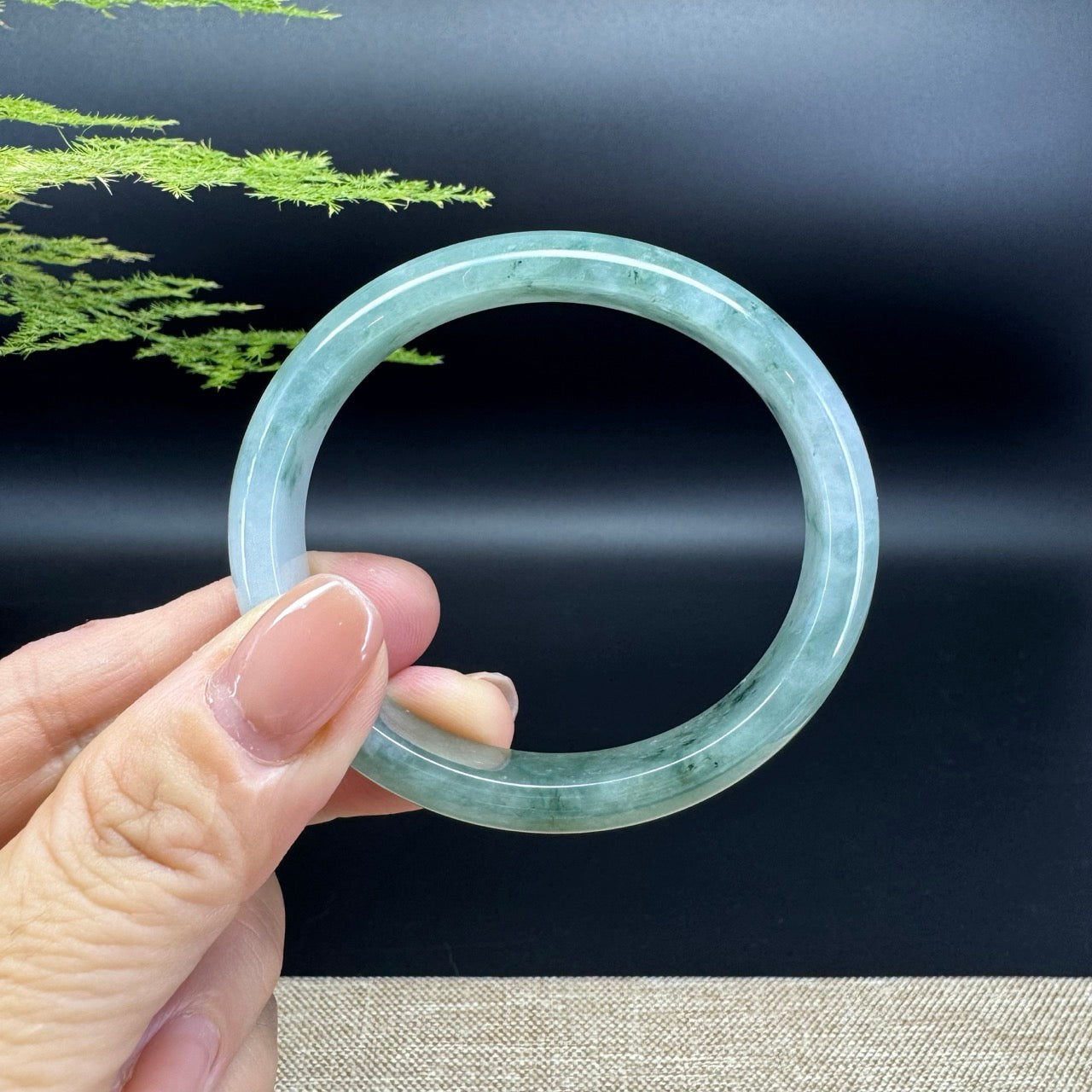 The bangle shape of the half round.The bangle color is icy green.