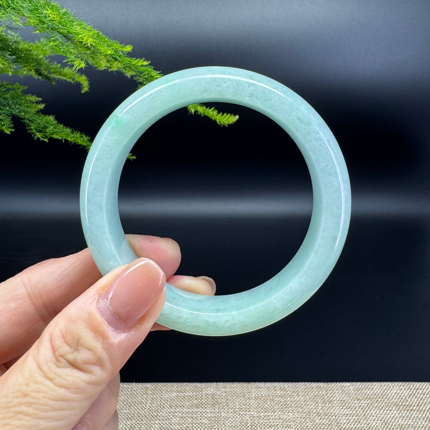 The bangle shape of the half round.The bangle color is icy apple green