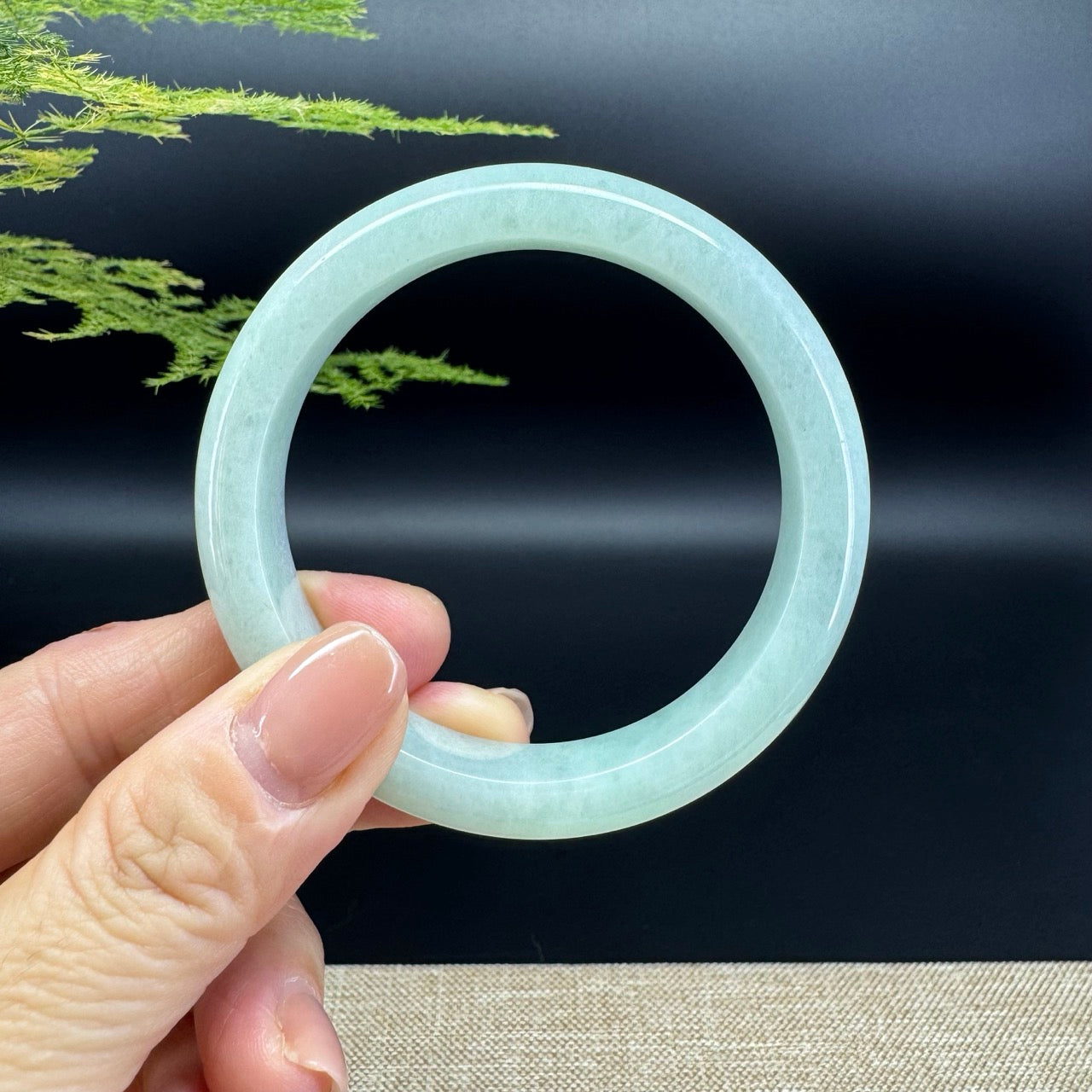 The bangle shape of the half round.The bangle color is green.