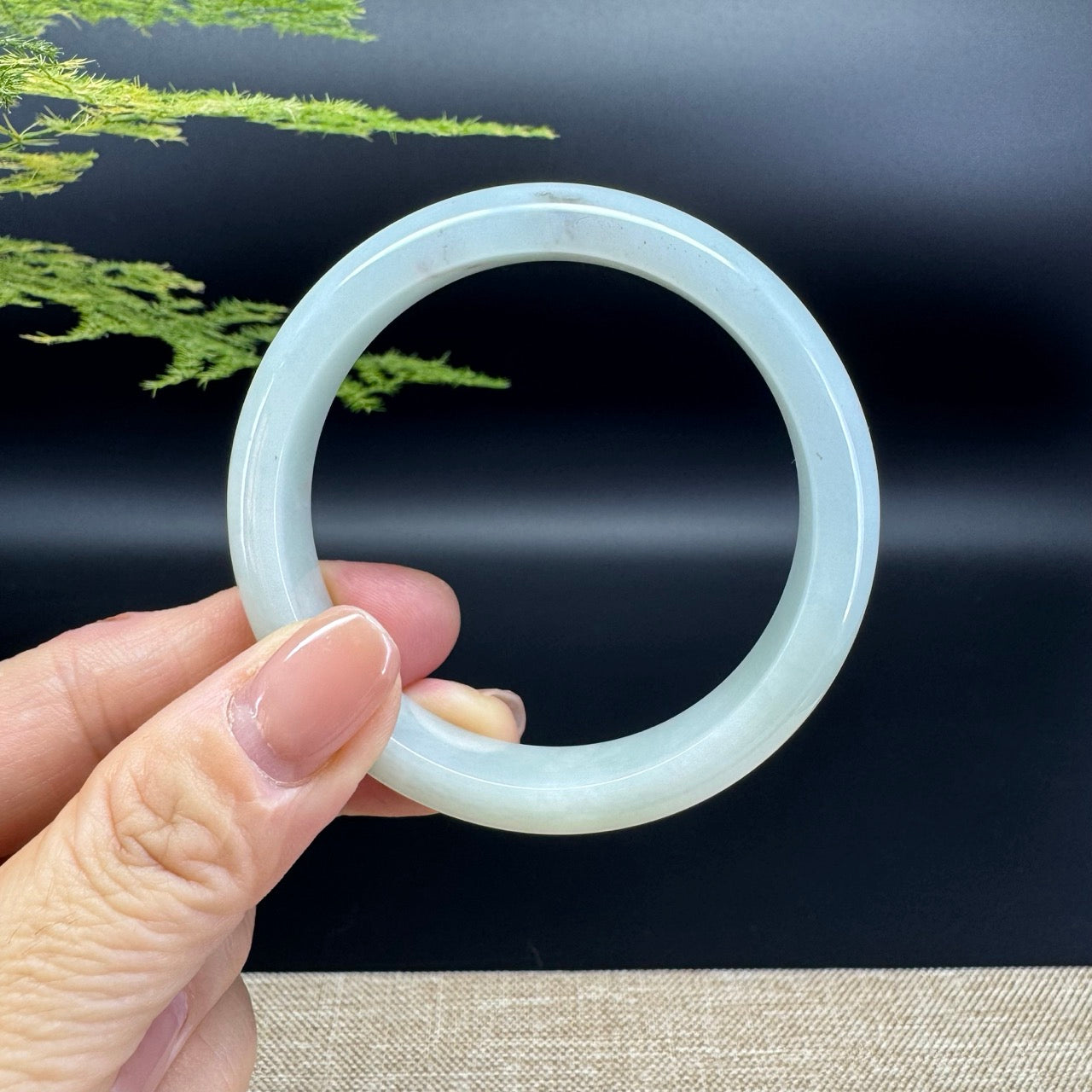 The bangle shape of the half round.The bangle color is icy green.