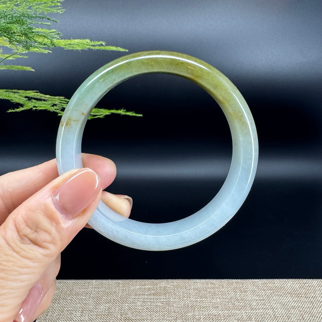 The bangle shape of the half round.The bangle color is icy yellow green.