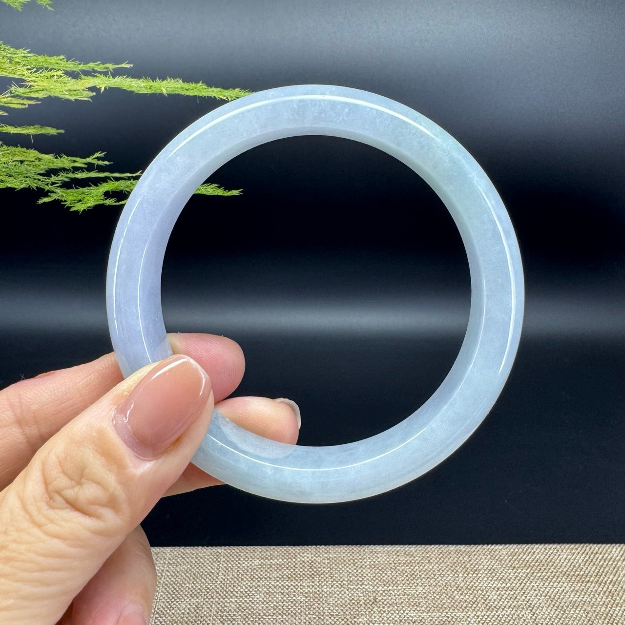 The bangle shape of the half round.The bangle color is icy lavender green.