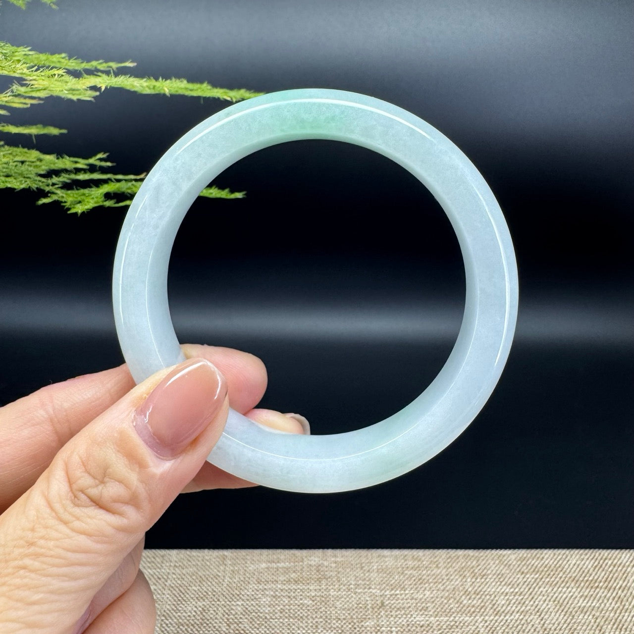 The bangle shape of the half round.The bangle color is icy green.