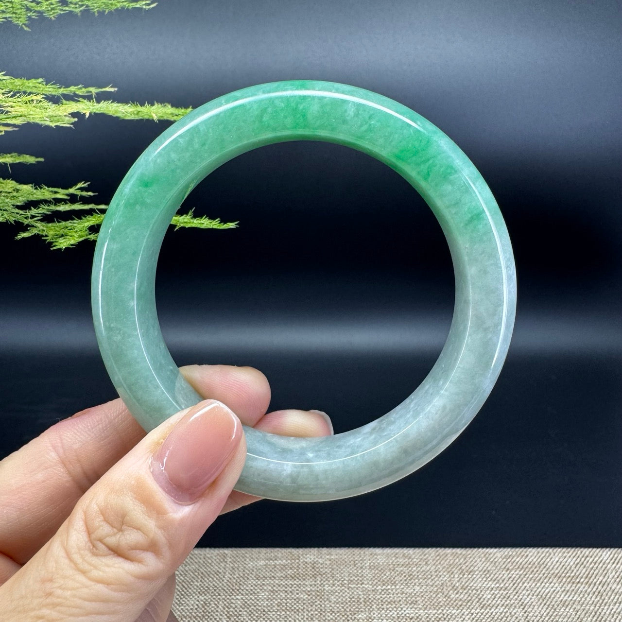 The bangle shape of the half round.The bangle color is icy spicy green.