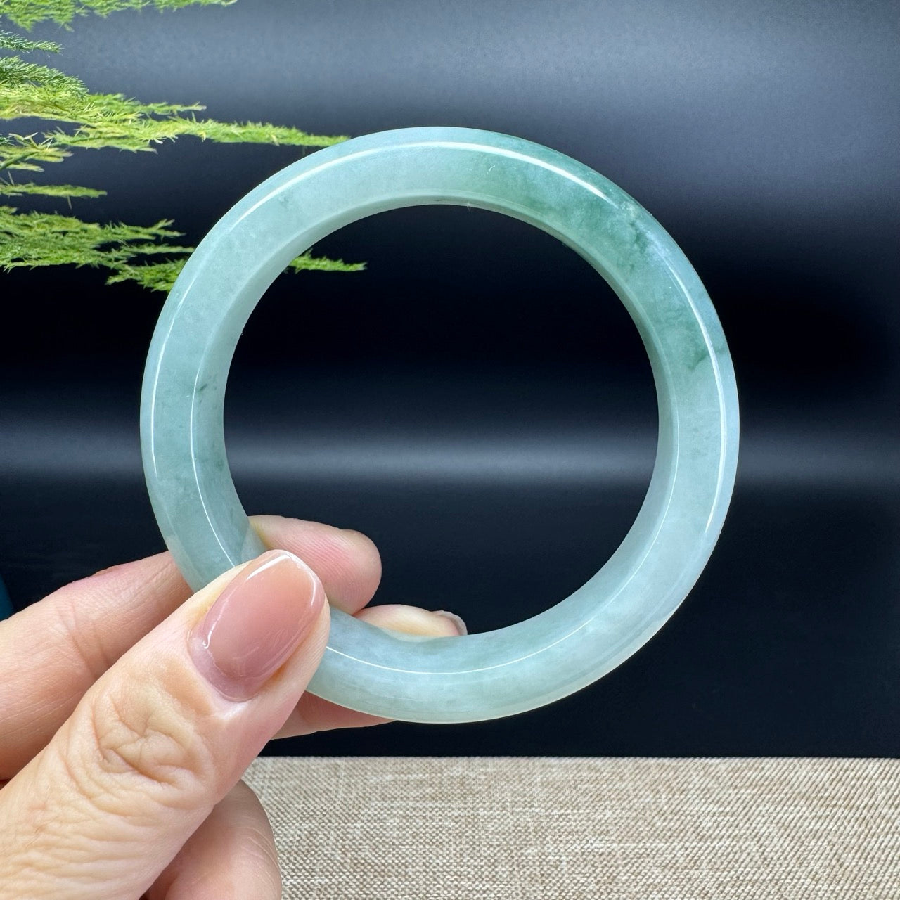 The bangle shape of the half round.The bangle color is icy green.