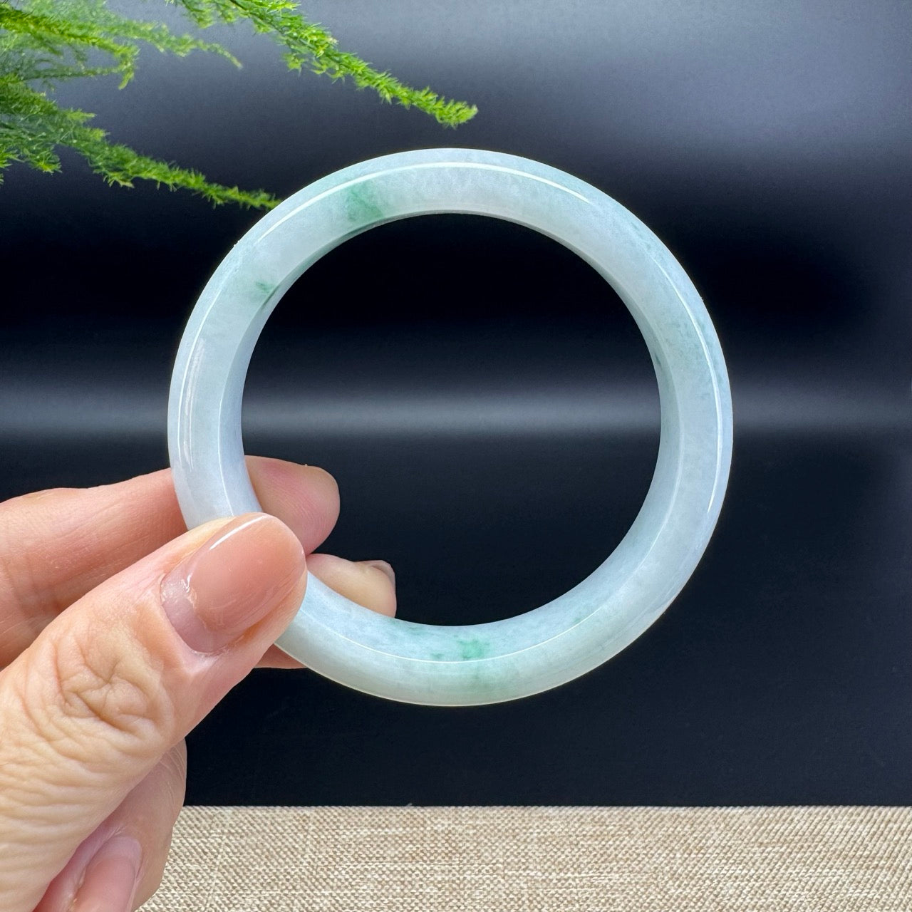 The bangle shape of the half round.The bangle color is green.