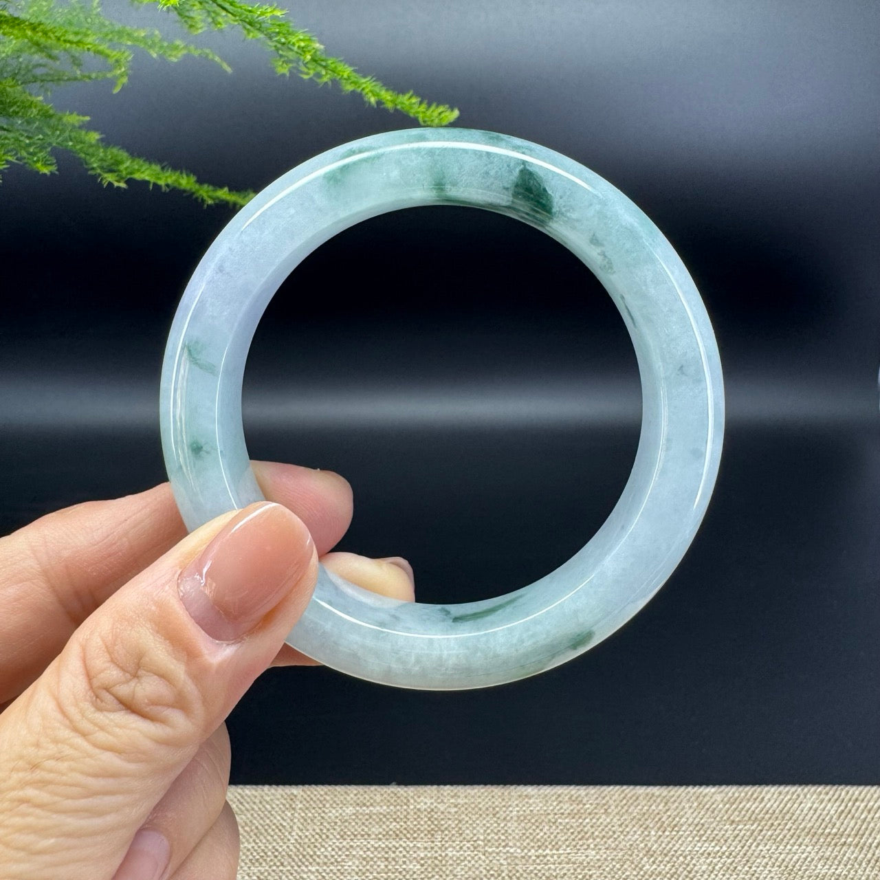 The bangle shape of the half round.The bangle color is icy green.