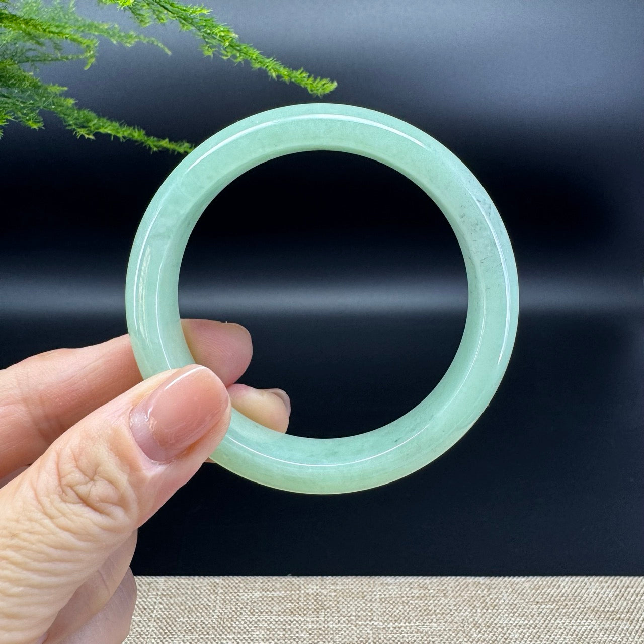 The bangle shape of the half round.The bangle color is green.
