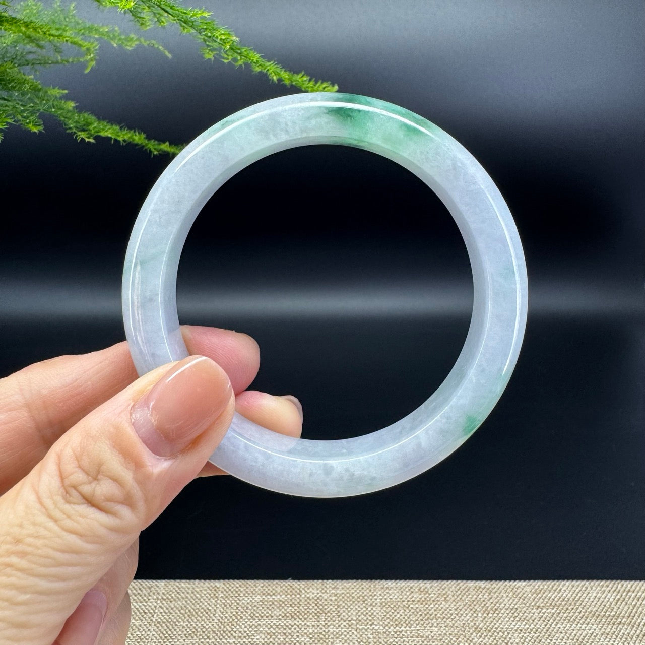 The bangle shape of the half round.The bangle color is icy green.