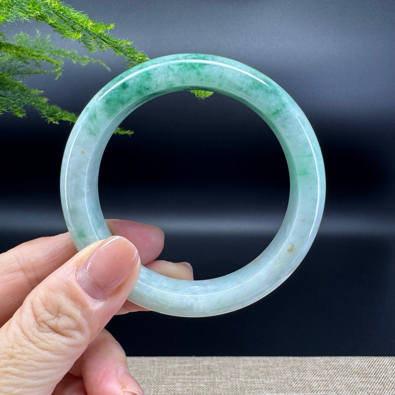 The bangle shape of the half round.The bangle color is icy green.
