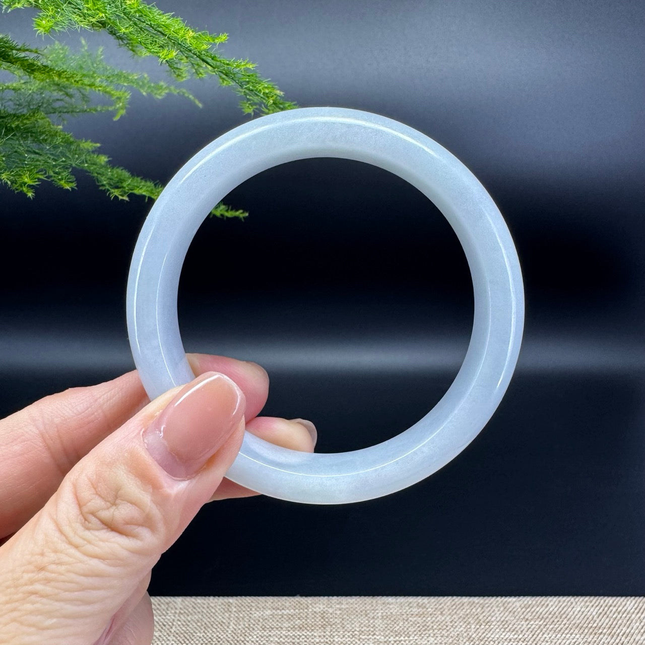 The bangle shape of the half round.The bangle color is lavender.