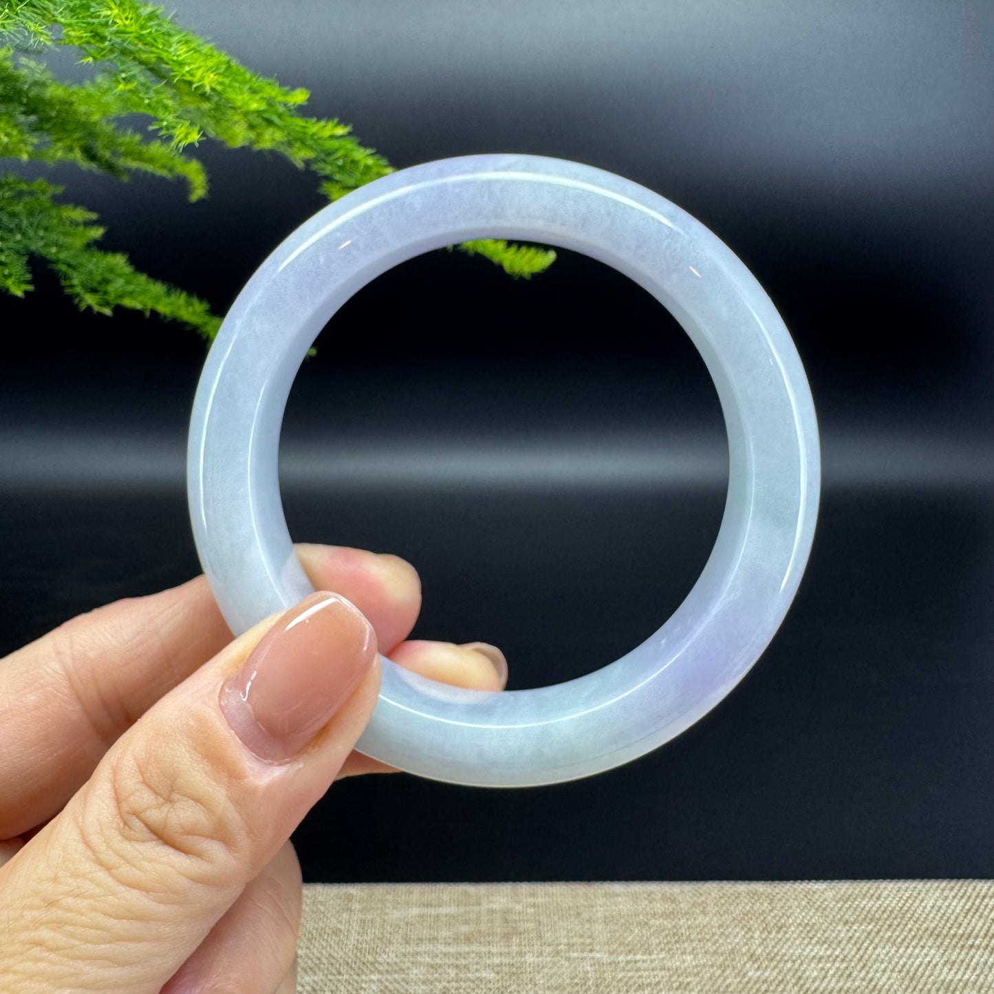 The bangle shape of the half round.The bangle color is lavender.