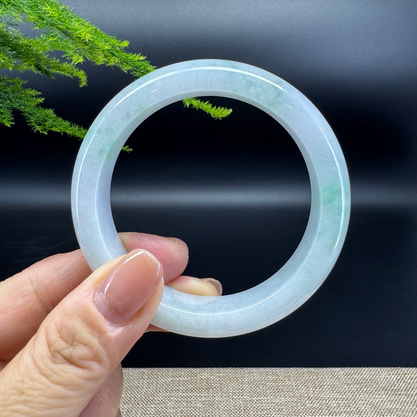 The bangle shape of the half round.The bangle color is icy green.