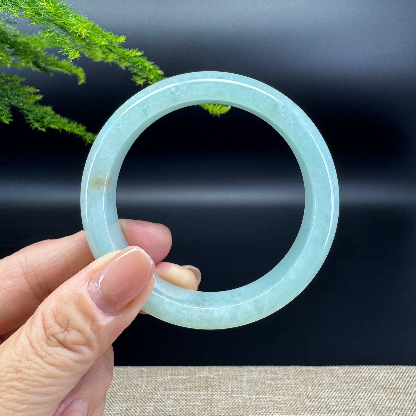 The bangle shape of the half round.The bangle color is icy green.