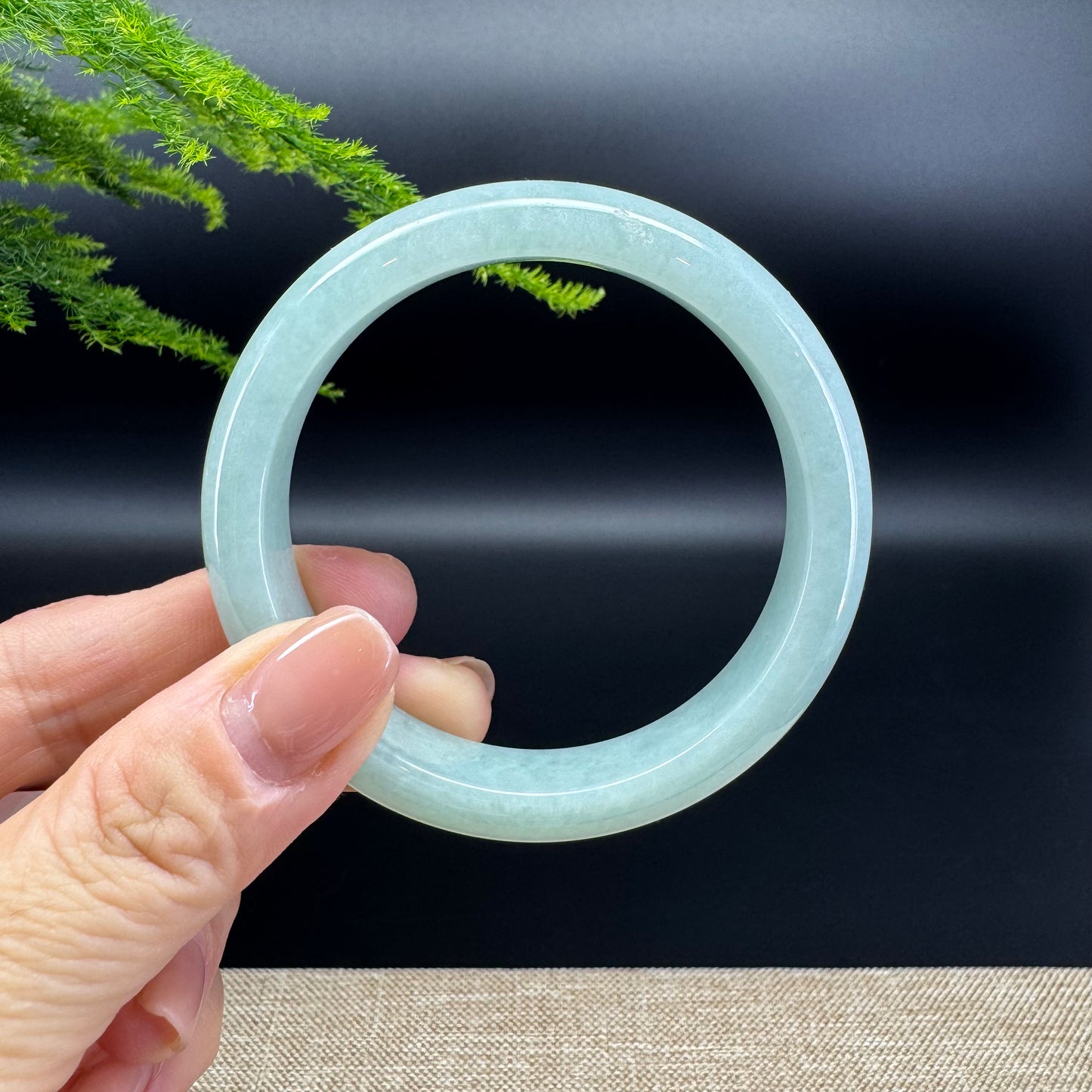The bangle shape of the half round.The bangle color is green.
