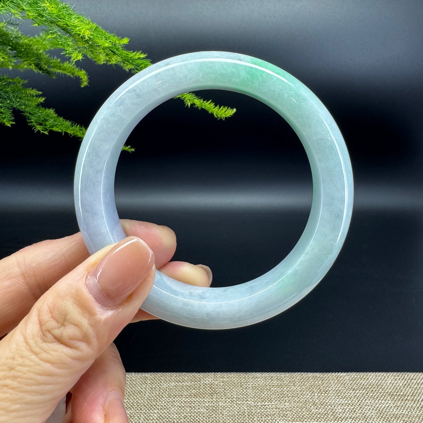 The bangle shape of the half round.The bangle color is lavender green.