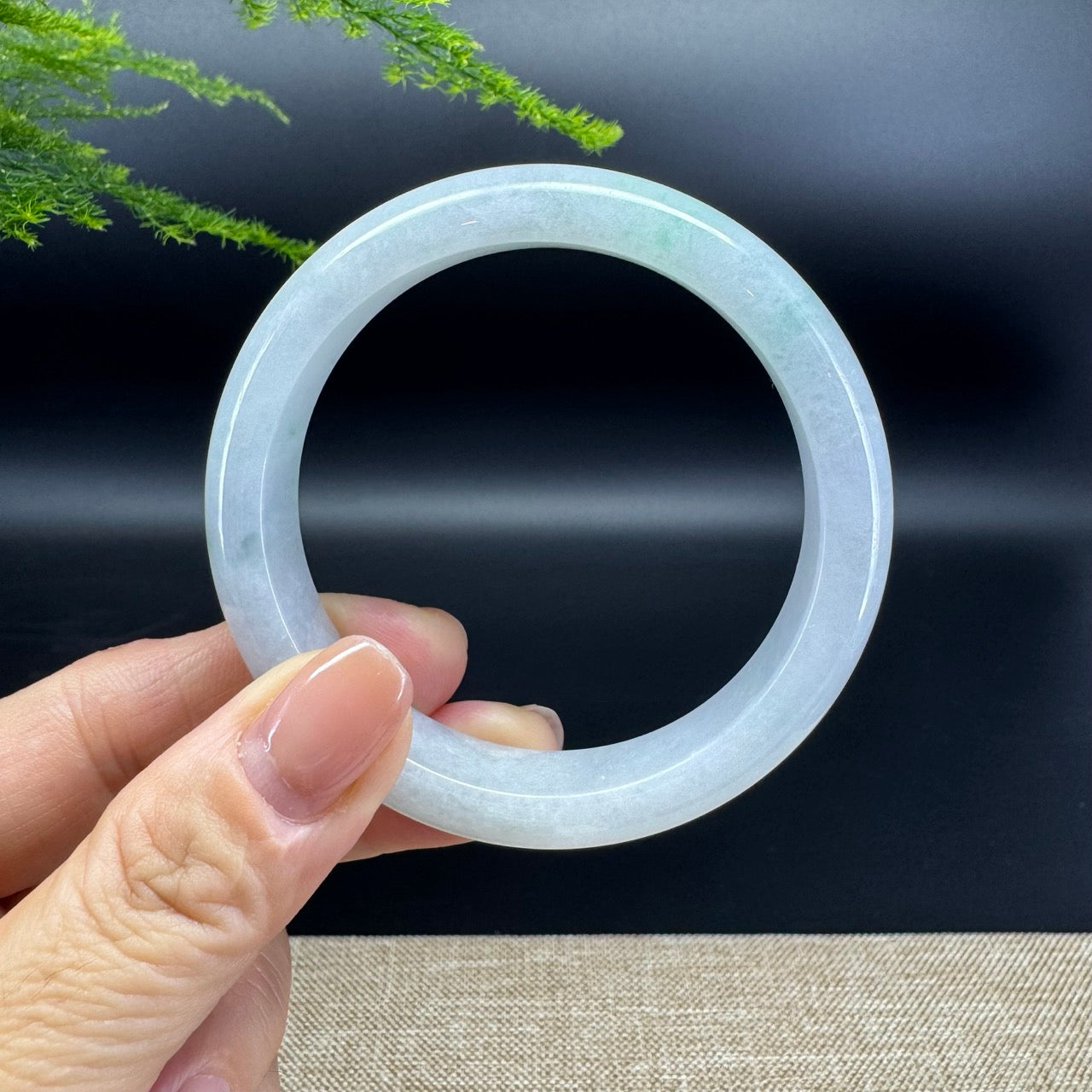 The bangle shape of the half round.The bangle color is icy green.