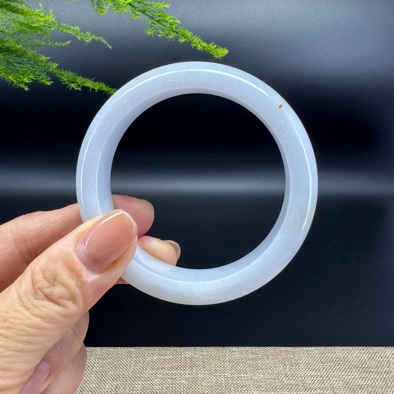 The bangle shape of the half round.The bangle color is icy lavender green.