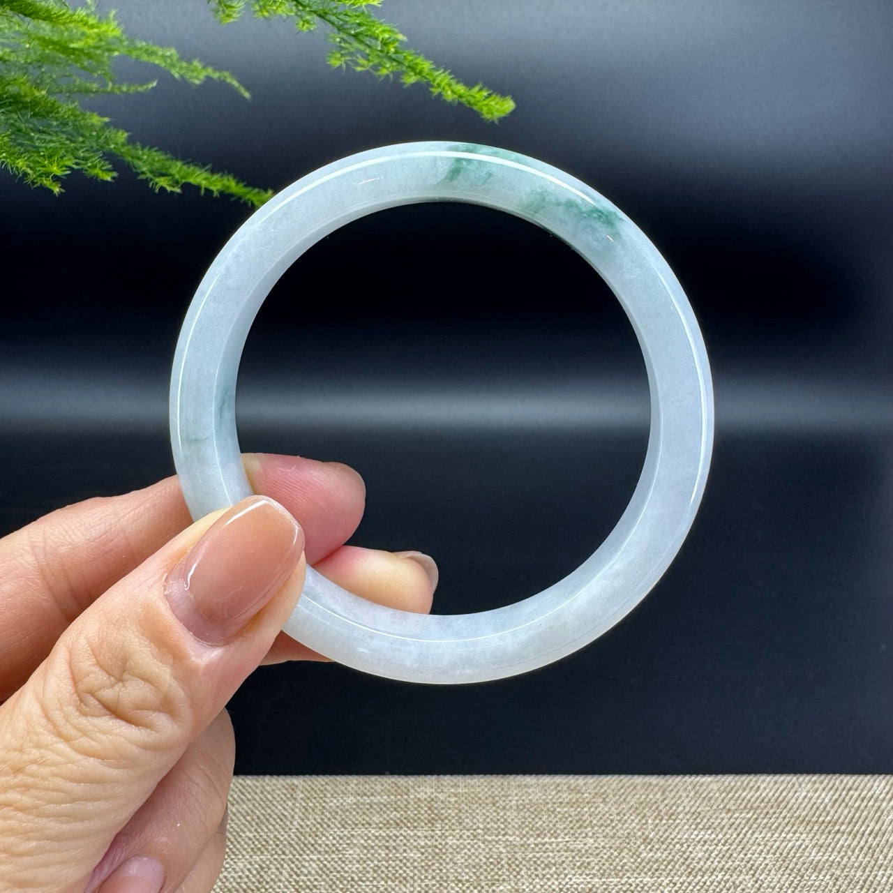 The bangle shape of the half round.The bangle color is icy green.