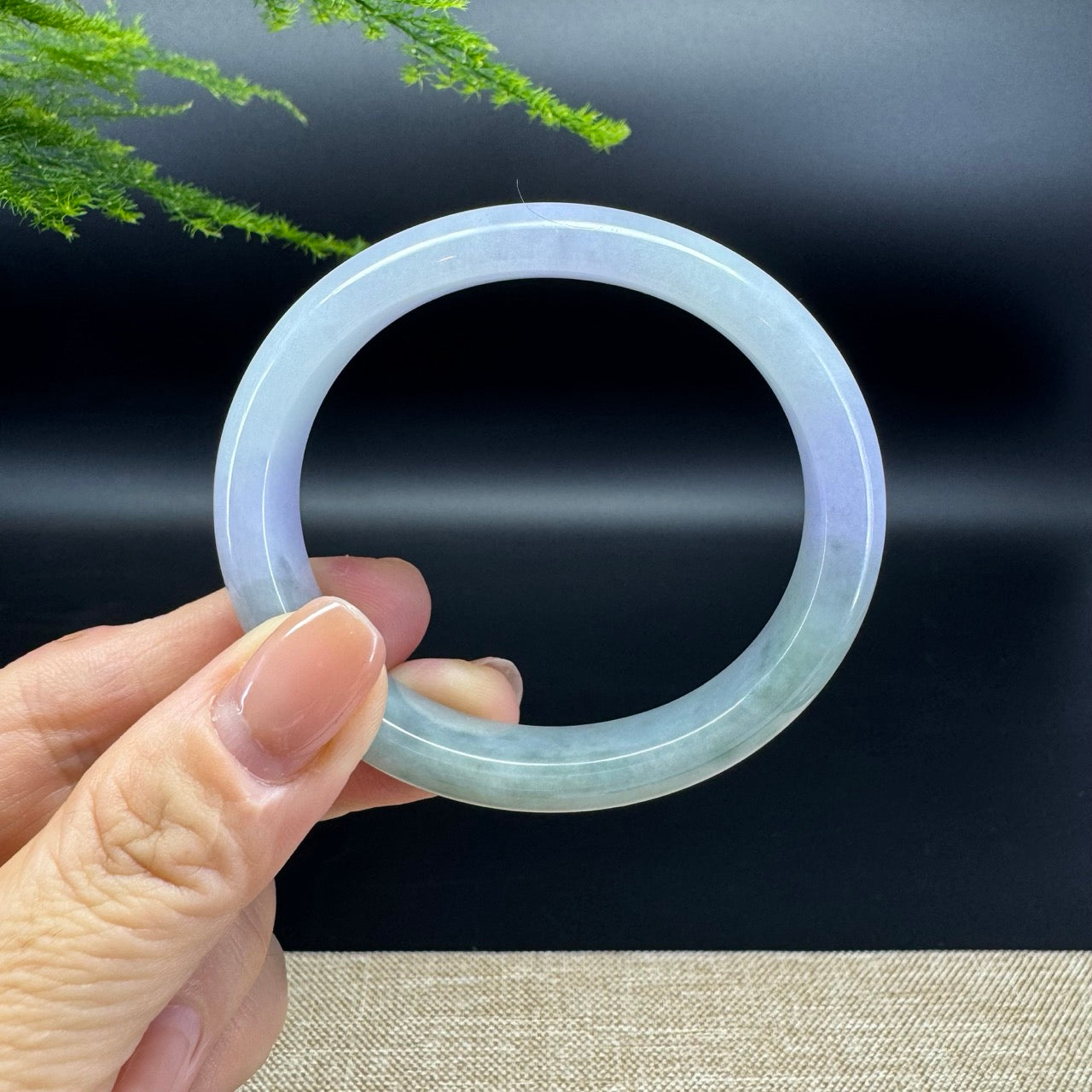The bangle shape of the half round.The bangle color is lavender green.