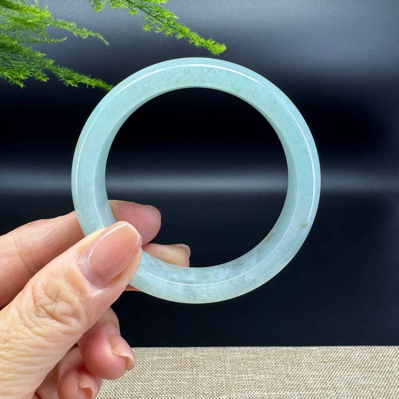 The bangle shape of the half round.The bangle color is icy green.