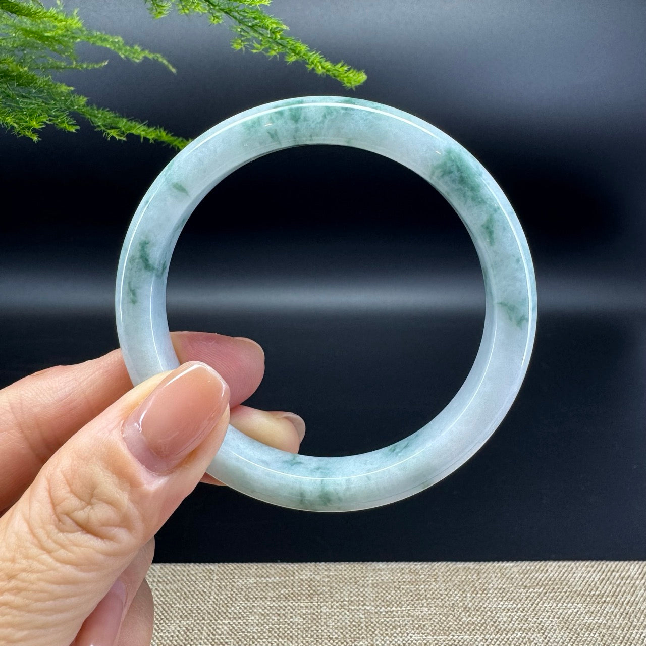 The bangle shape of the half round.The bangle color is green.