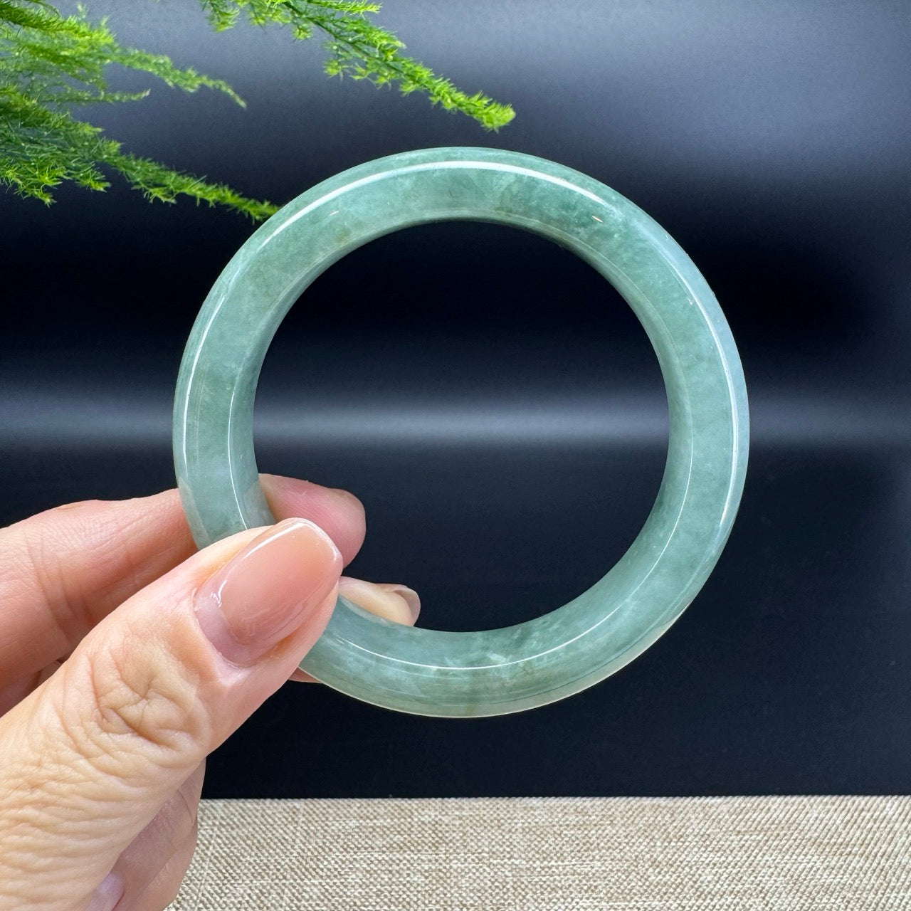 The bangle shape of the half round.The bangle color is oil green.