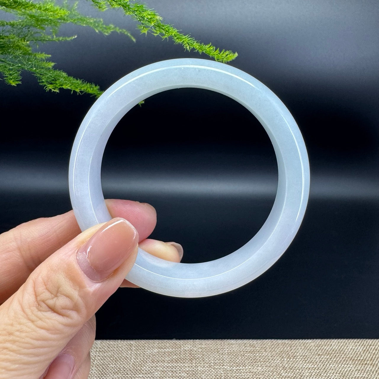 The bangle shape of the half round.The bangle color is lavender green.