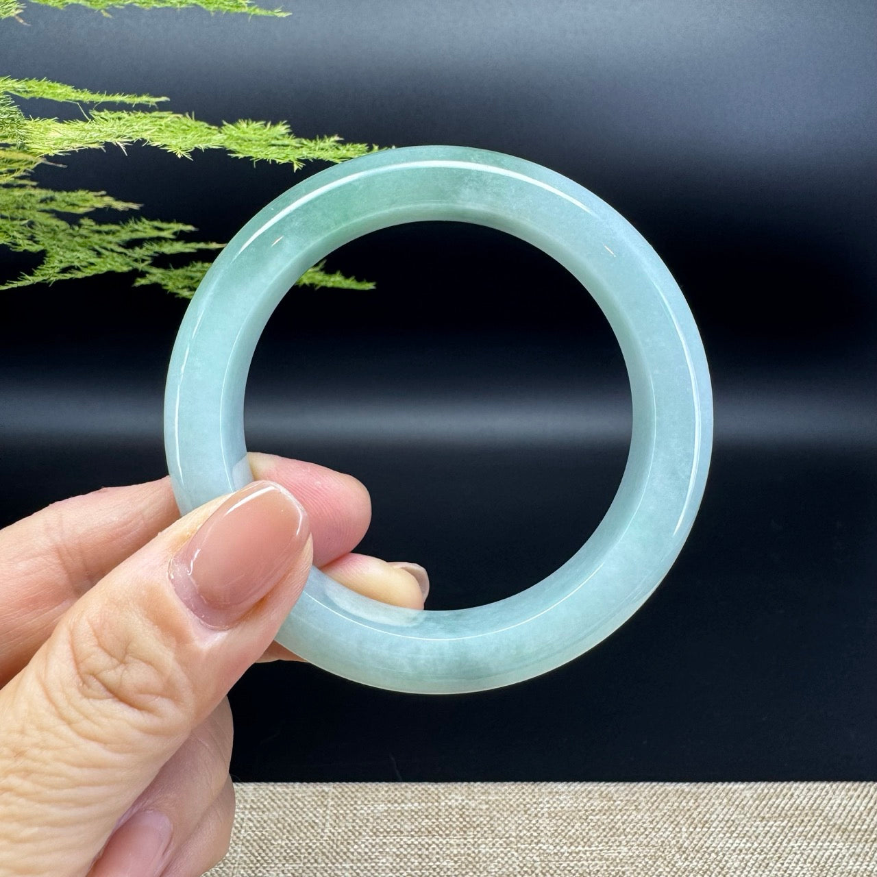 The bangle shape of the half round.The bangle color is icy green.